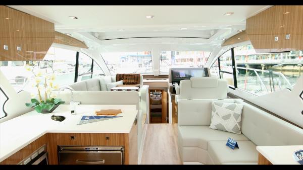 Slide: The Image of Luxurious interior of 2024 Cruisers Yachts 50 Cantius with modern furnishings and large windows. - 30
