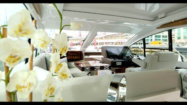 Slide: The Image of Interior of 2024 Cruisers Yachts 50 Cantius with luxurious seating and elegant decor. - 33