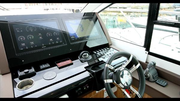 Slide: The Image of 2024 Cruisers Yachts 50 Cantius helm with advanced navigation and control systems. - 35