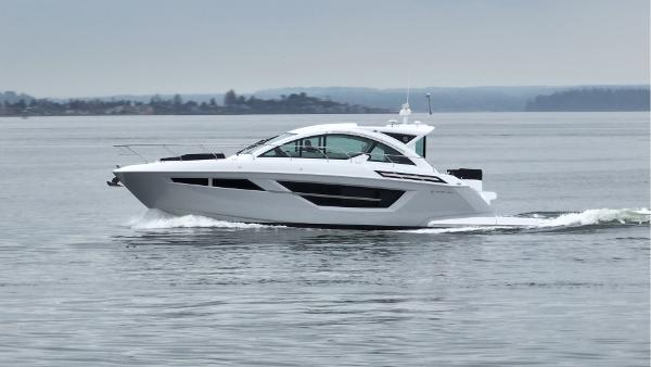 Slide: The Image of 2024 Cruisers Yachts 50 Cantius cruising on calm waters. - 4