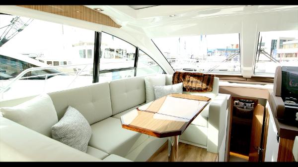 Slide: The Image of Luxurious interior of the 2024 Cruisers Yachts 50 Cantius with plush seating and modern design. - 40