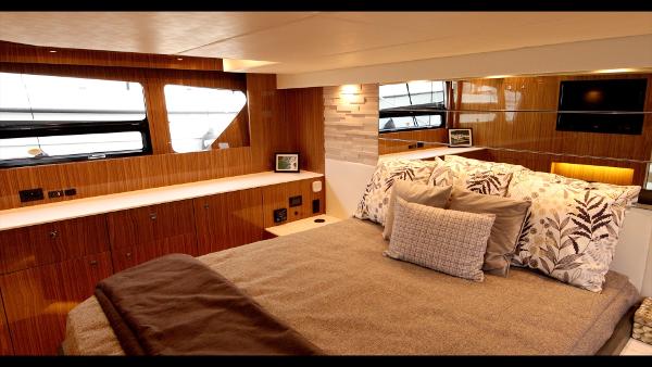Slide: The Image of Luxurious bedroom interior of 2024 Cruisers Yachts 50 Cantius with modern decor and large windows. - 46