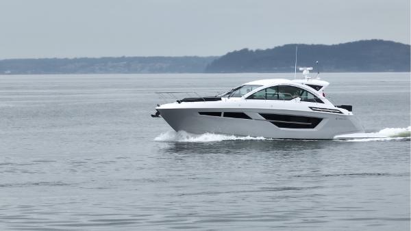 Slide: The Image of 2024 Cruisers Yachts 50 Cantius cruising on calm waters. - 5