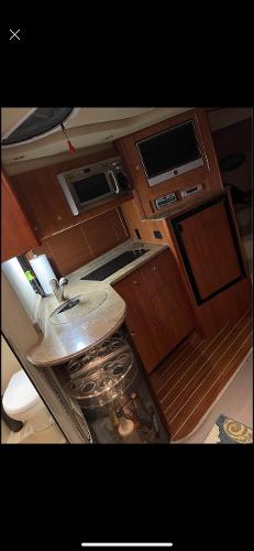 Slide: The Image of 2008 Cruisers Yachts Express interior kitchen with modern amenities. - 13