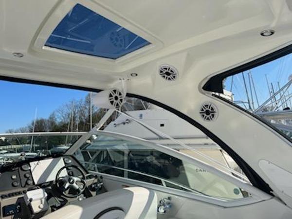 Slide: The Image of Interior of 2008 Cruisers Yachts Express with skylight and modern dashboard. - 4