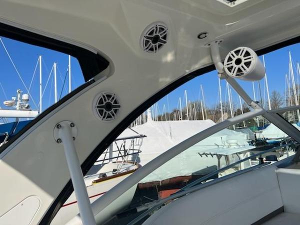 Slide: The Image of 2008 Cruisers Yachts Express interior with speakers and marina view. - 5