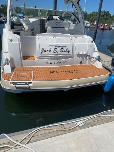 Slide: The Image of 2008 Cruisers Yachts Express boat docked, rear view with Jack E. Baby nameplate. - 7