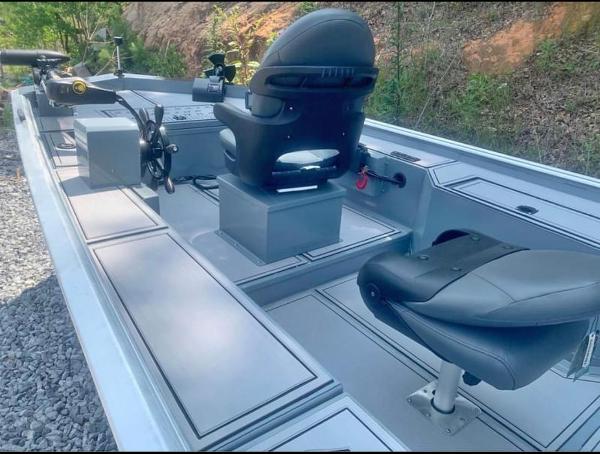 Slide: The Image of 2025 Custom 1860 Ultimate Panfish boat interior with seating and fishing equipment. - 0