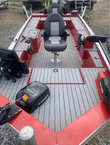Slide: The Image of 2025 Custom 1860 Ultimate Panfish boat with red accents and fishing gear. - 5