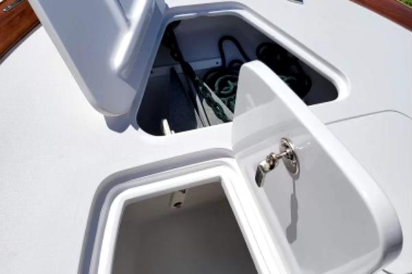 Slide: The Image of 2017 Custom Envi Redfisher boat storage compartments with open hatches. - 5