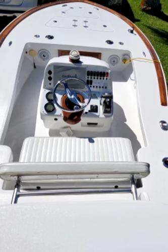 Slide: The Image of 2017 Custom Envi Redfisher boat cockpit with steering wheel and control panel. - 6