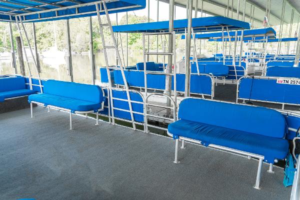 Slide: The Image of Interior of a 2000 Custom Lake Wind 25 x 10 Pontoon with blue seating. - 15
