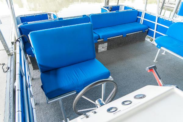 Slide: The Image of Interior of a 2000 Custom Lake Wind 25 x 10 Pontoon with blue seating. - 18