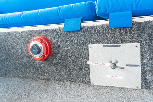 Slide: The Image of Control panel and switch on a 2000 Custom Lake Wind 25 x 10 Pontoon boat. - 24