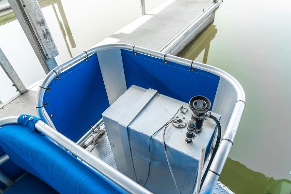 Slide: The Image of Custom Lake Wind 25 x 10 Pontoon 2000, blue seating, docked at marina. - 25