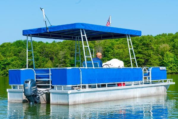 Slide: The Image of Custom 2000 Lake Wind 25 x 10 Pontoon boat on a calm lake. - 4