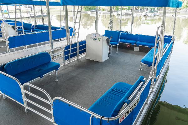 Slide: The Image of Interior of a 2000 Custom Lake Wind 25 x 10 Pontoon boat with blue seating. - 9