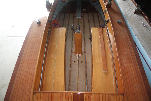 Slide: The Image of 1934 Custom Northern Michigan NM wooden boat interior with bench seats. - 15