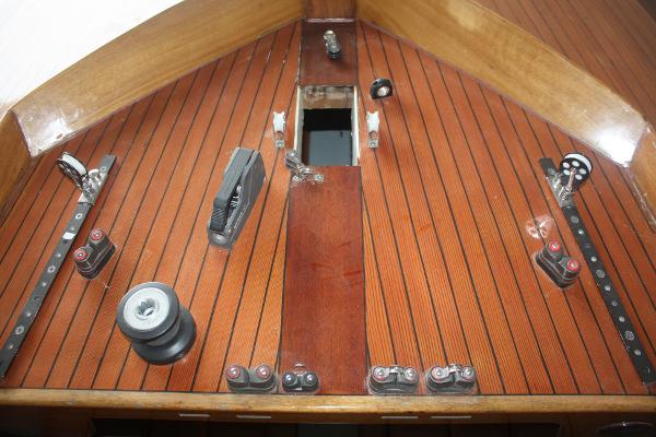 Slide: The Image of 1934 Custom Northern Michigan NM boat deck with wooden finish and sailing hardware. - 25