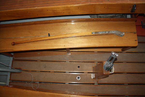 Slide: The Image of 1934 Custom Northern Michigan NM wooden boat interior with tiller and rigging. - 26