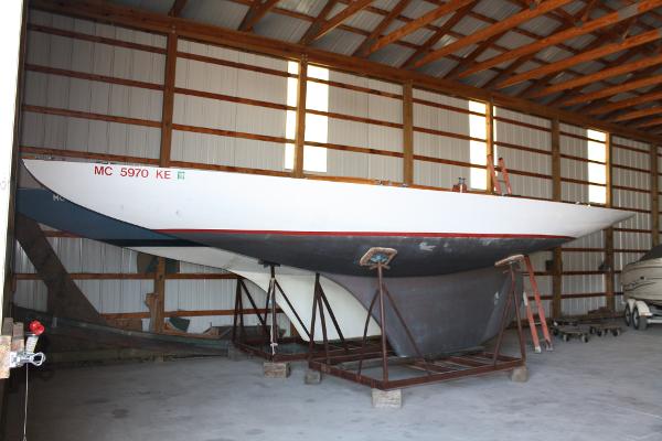 Slide: The Image of 1934 Custom Northern Michigan NM sailboat stored in a wooden boathouse. - 4