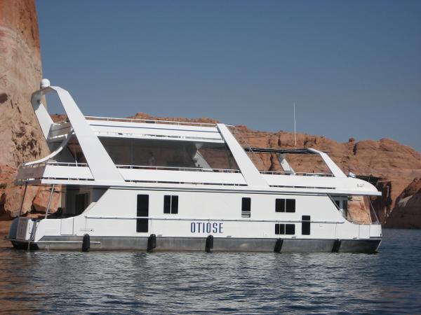 Slide: The Image of Custom 2005 houseboat The Entourage Shares #21,33 and 40 on a serene lake. - 1