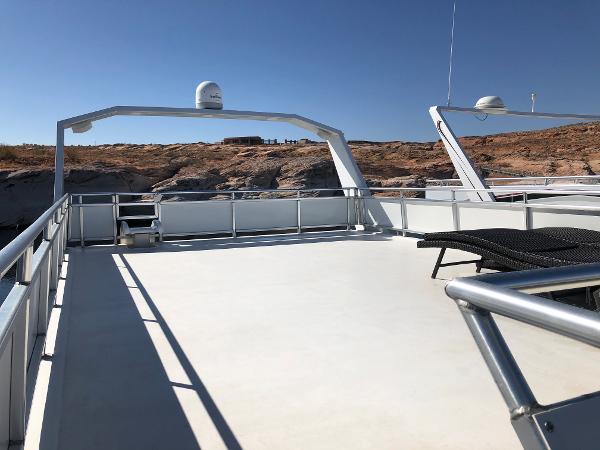 Slide: The Image of Top deck of 2005 Custom yacht The Entourage Shares #21,33 and 40 with lounge chairs. - 11