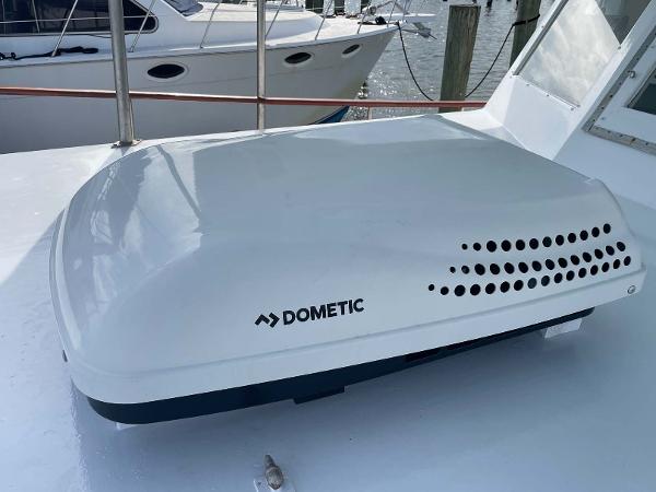 Slide: The Image of Dometic air conditioning unit on 1987 Custom Trawler Biloxi Lugger boat deck. - 11