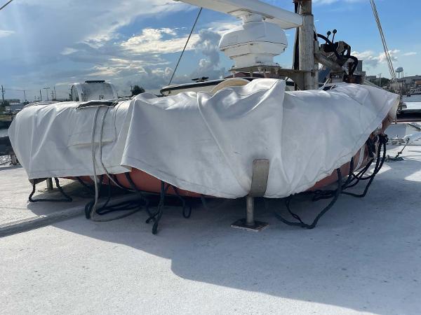 Slide: The Image of Covered deck equipment on 1987 Custom Trawler Biloxi Lugger under a cloudy sky. - 12
