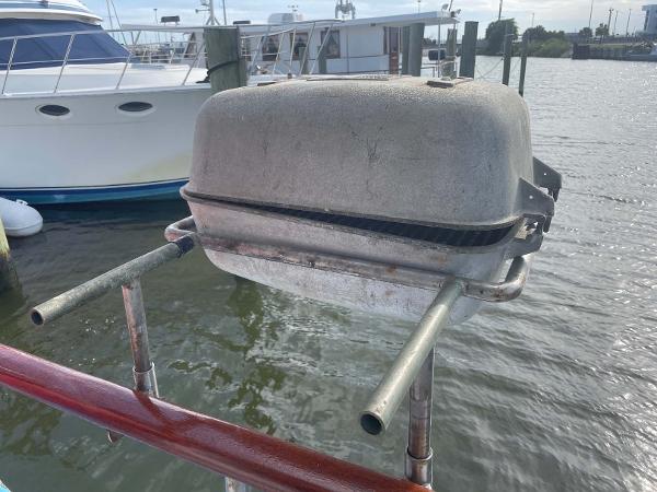 Slide: The Image of Outdoor grill mounted on a 1987 Custom Trawler Biloxi Lugger, docked by the water. - 21