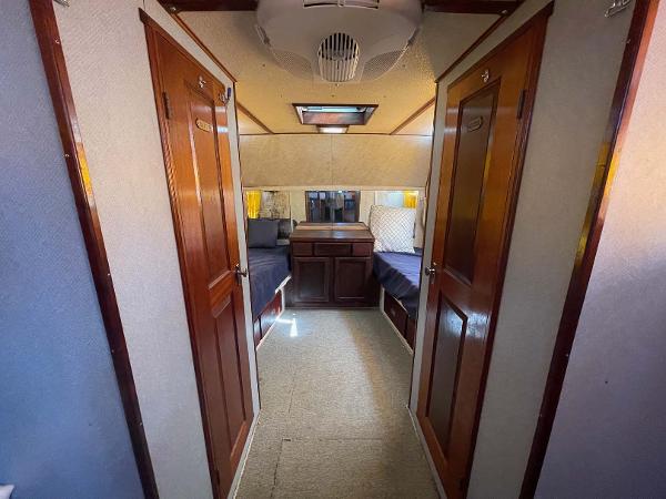 Slide: The Image of Interior of 1987 Custom Trawler Biloxi Lugger with twin beds and wooden doors. - 39