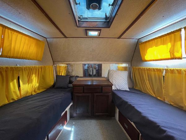 Slide: The Image of Interior of 1987 Custom Trawler Biloxi Lugger with yellow curtains and twin beds. - 40