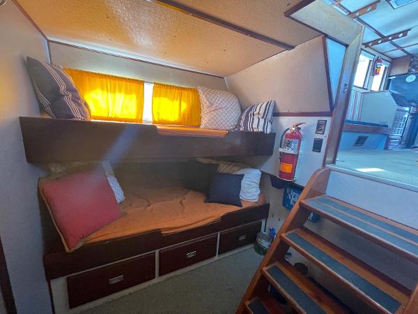 Slide: The Image of Cozy cabin interior of 1987 Custom Trawler Biloxi Lugger with bunk beds and wooden stairs. - 41