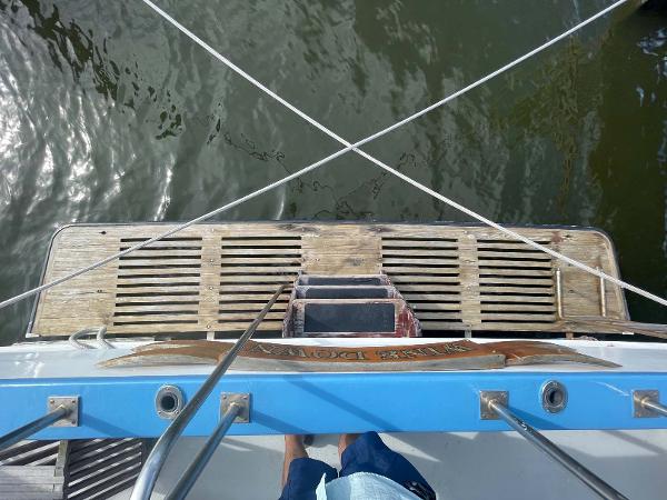 Slide: The Image of 1987 Custom Trawler Biloxi Lugger deck view with wooden platform and railing. - 49