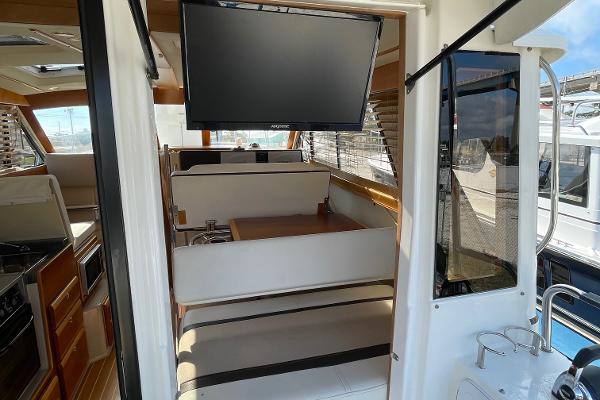 Slide: The Image of Interior of 2016 Cutwater 30 Sedan LE with TV and dining area. - 13