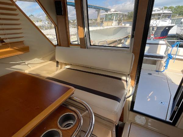 Slide: The Image of Interior of 2016 Cutwater 30 Sedan LE boat with seating and table. - 18