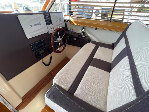Slide: The Image of Interior of 2016 Cutwater 30 Sedan LE with Garmin navigation system and comfortable seating. - 19