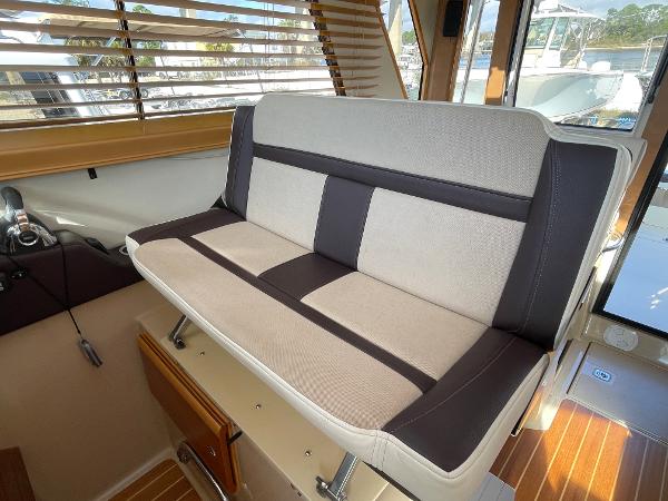 Slide: The Image of 2016 Cutwater 30 Sedan LE interior seating with striped upholstery. - 21