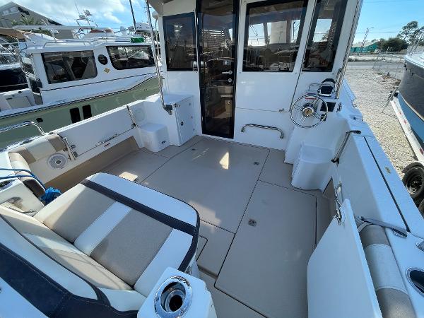 Slide: The Image of 2016 Cutwater 30 Sedan LE boat interior with seating and helm station. - 3
