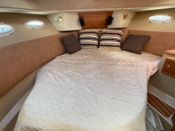 Slide: The Image of Cozy cabin interior of 2016 Cutwater 30 Sedan LE with comfortable bedding. - 33
