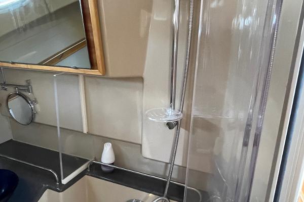 Slide: The Image of 2016 Cutwater 30 Sedan LE bathroom with shower and mirror. - 38