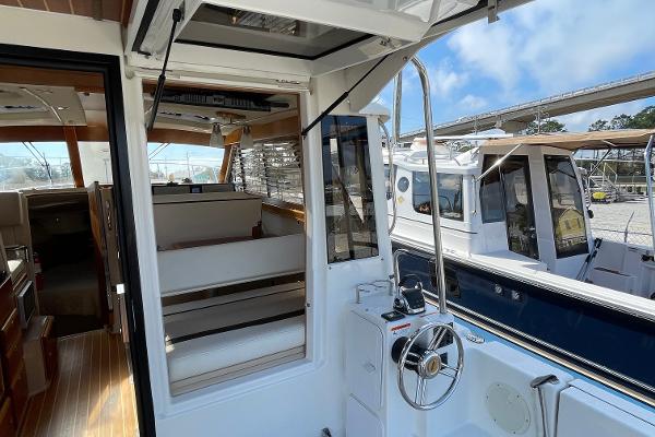 Slide: The Image of 2016 Cutwater 30 Sedan LE boat interior with helm and seating area. - 4