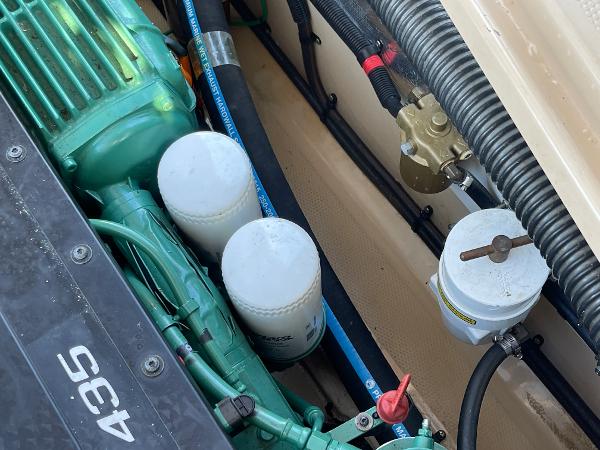 Slide: The Image of Engine compartment of a 2016 Cutwater 30 Sedan LE with visible filters and hoses. - 41