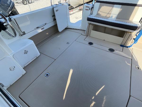 Slide: The Image of 2016 Cutwater 30 Sedan LE boat interior with seating and storage compartments. - 7