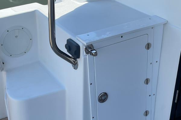 Slide: The Image of 2016 Cutwater 30 Sedan LE boat storage compartment with stainless steel handle. - 8