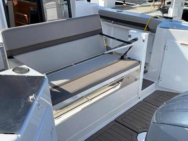 Slide: The Image of 2023 Cutwater C-288 boat interior with cushioned seating and modern design. - 12