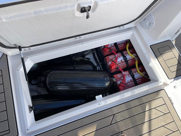Slide: The Image of Storage compartment of 2023 Cutwater C-288 boat with batteries and fenders. - 20