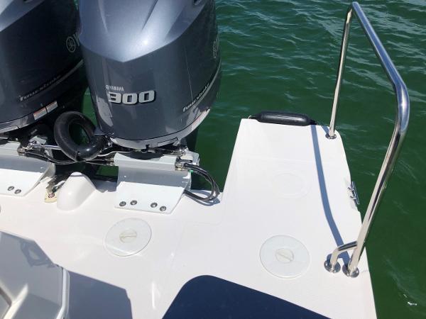 Slide: The Image of 2025 Cutwater C-32 Sedan boat with twin Yamaha 300 engines on a sunny day. - 10