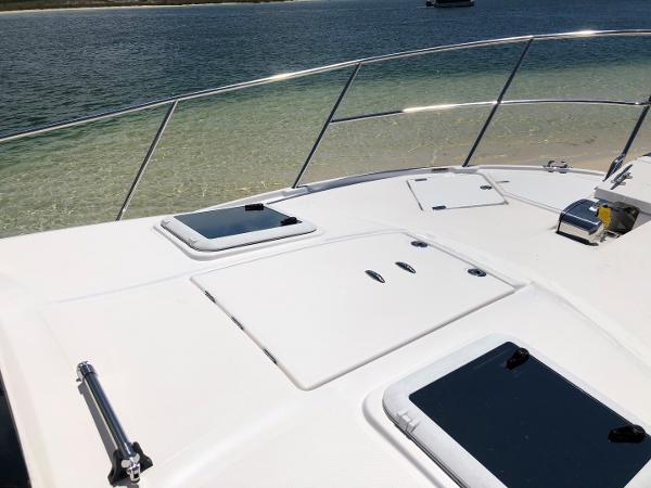 Slide: The Image of 2025 Cutwater C-32 Sedan boat deck with ocean view. - 15