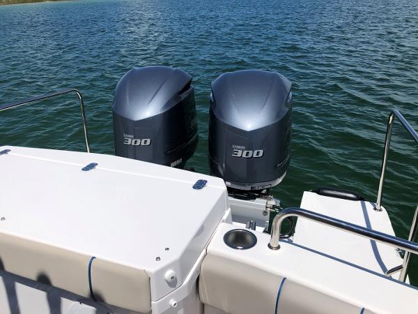 Slide: The Image of 2025 Cutwater C-32 Sedan with twin Yamaha 300 outboard engines on open water. - 9
